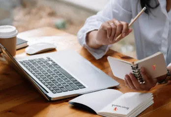 A woman working at her laptop.