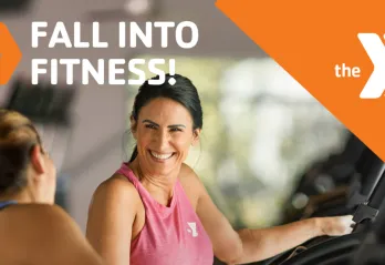Two women talking while working at out the Y