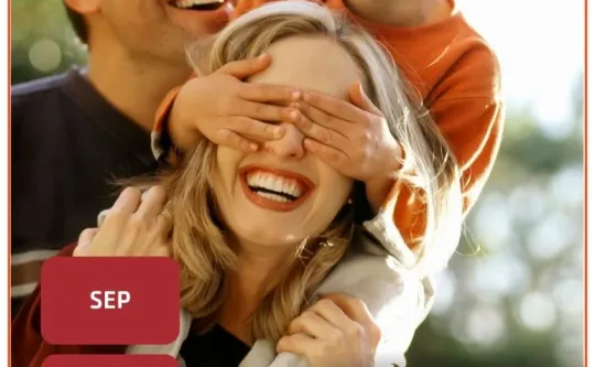 Cover of the 2025 Olympic Peninsula YMCA Fall Program Guide which depicts a family portrait in Fall.