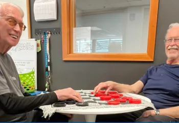 Two men playing checkers