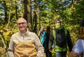 People hiking on a trail outdoors.