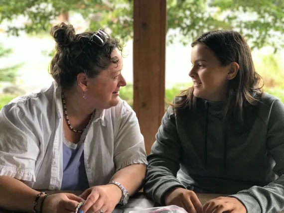 Adult woman mentoring a young woman