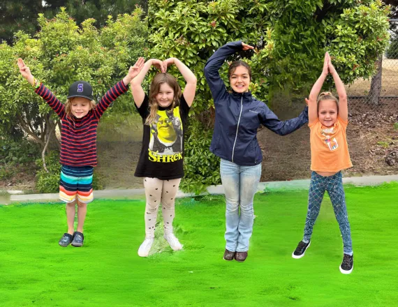 Kids spelling out YMCA at summer camp