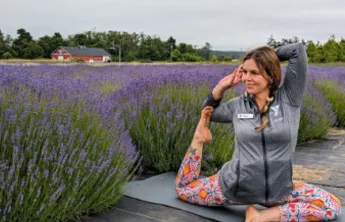 Woman doing yoga in a lavender field
