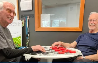 Two men playing checkers
