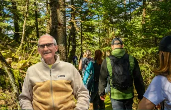 People hiking on a trail outdoors.