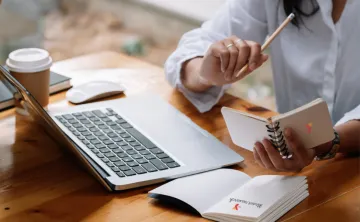 A woman working at her laptop.