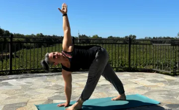 A photo of a women doing a yoga pose.