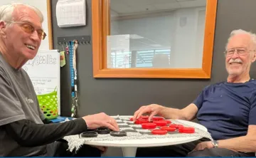 Two men playing checkers