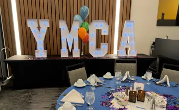 YMCA marquee letters at a dinner event